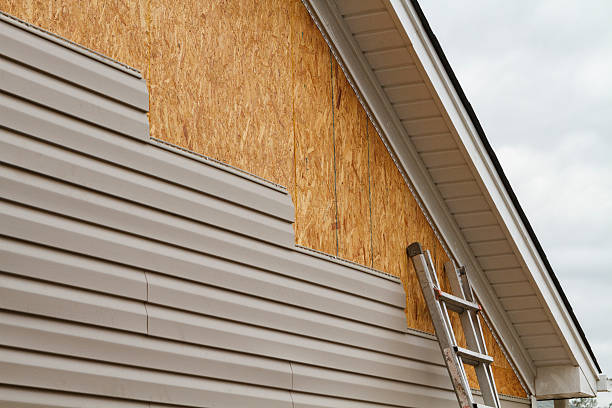 Professional Siding Installation technician working in West Islip, NY
